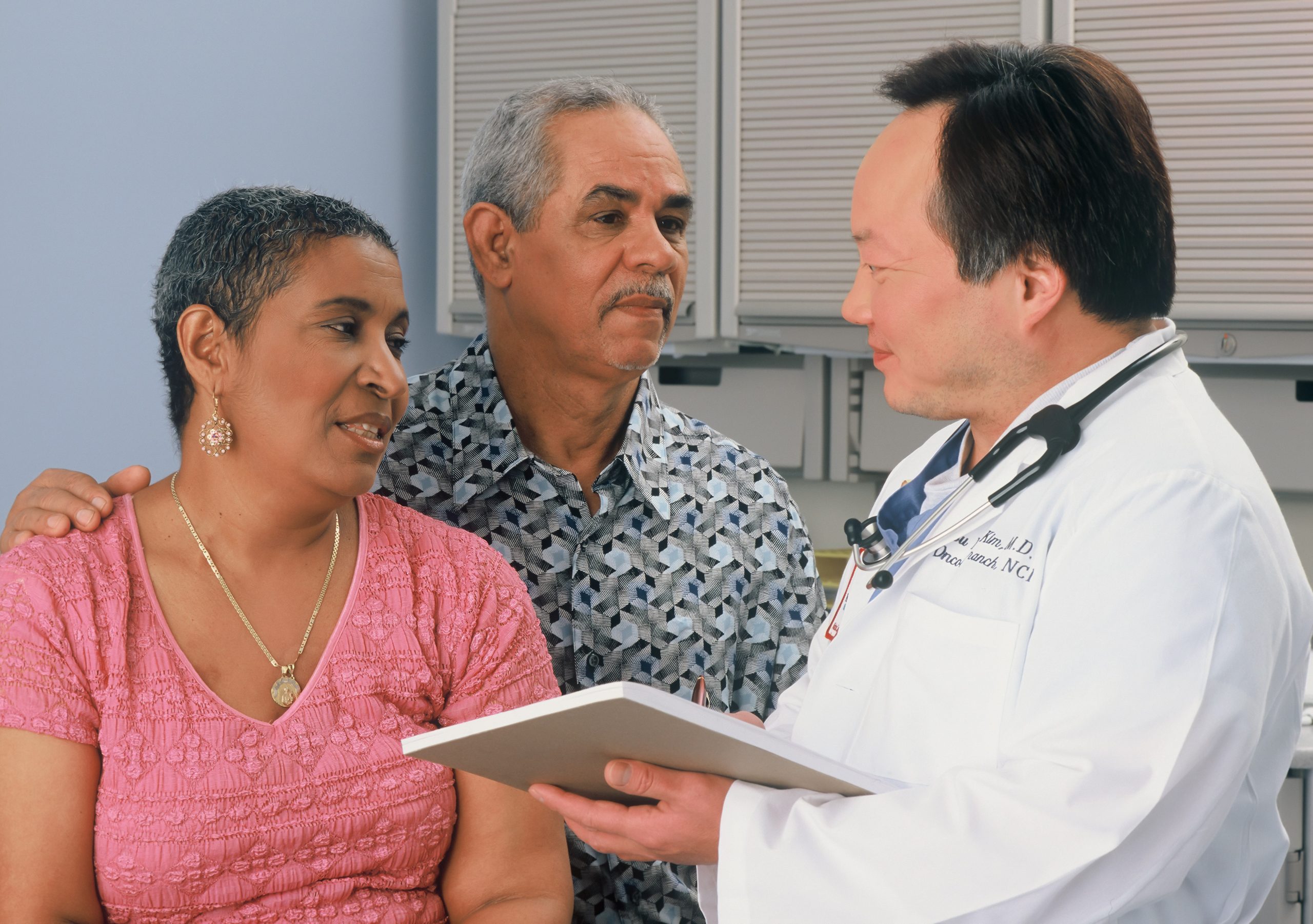 a doctor converses with a patient